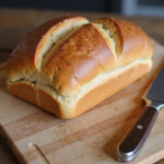 Final loaf of homemade bread, perfect for slicing and serving.